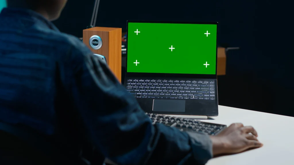 Laptop screen lines and dead pixels being diagnosed and repaired by a professional technician