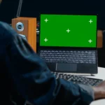 Laptop screen lines and dead pixels being diagnosed and repaired by a professional technician