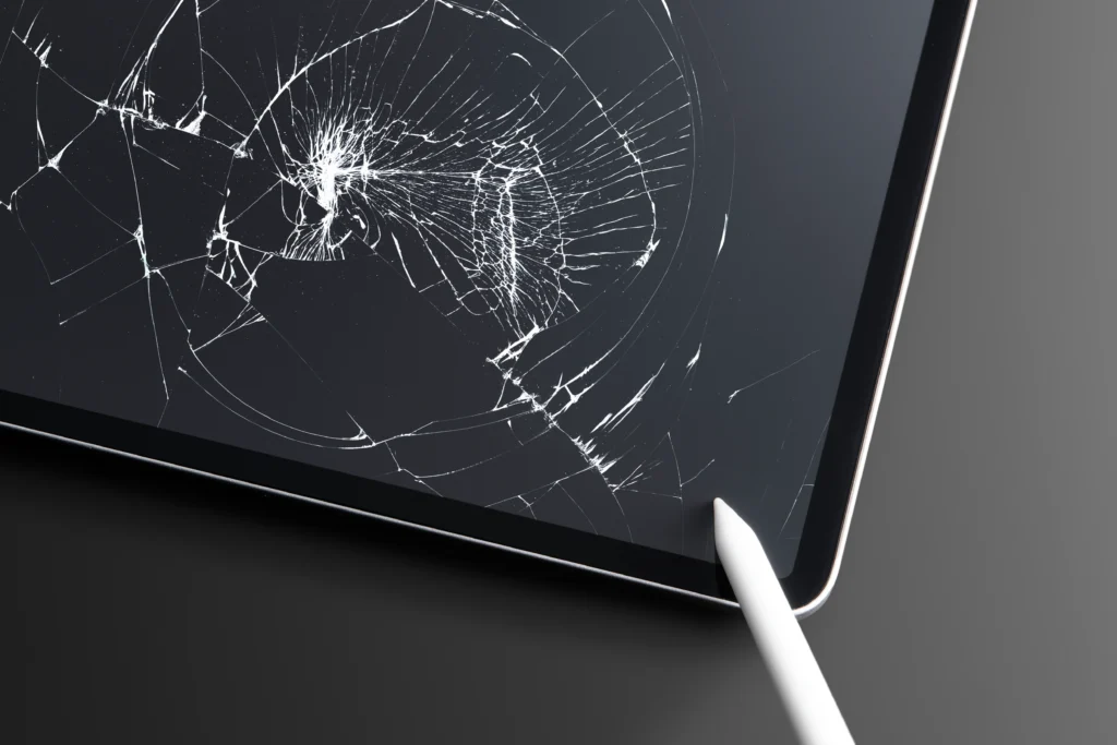 Technician performing cracked laptop screen fix on a modern laptop