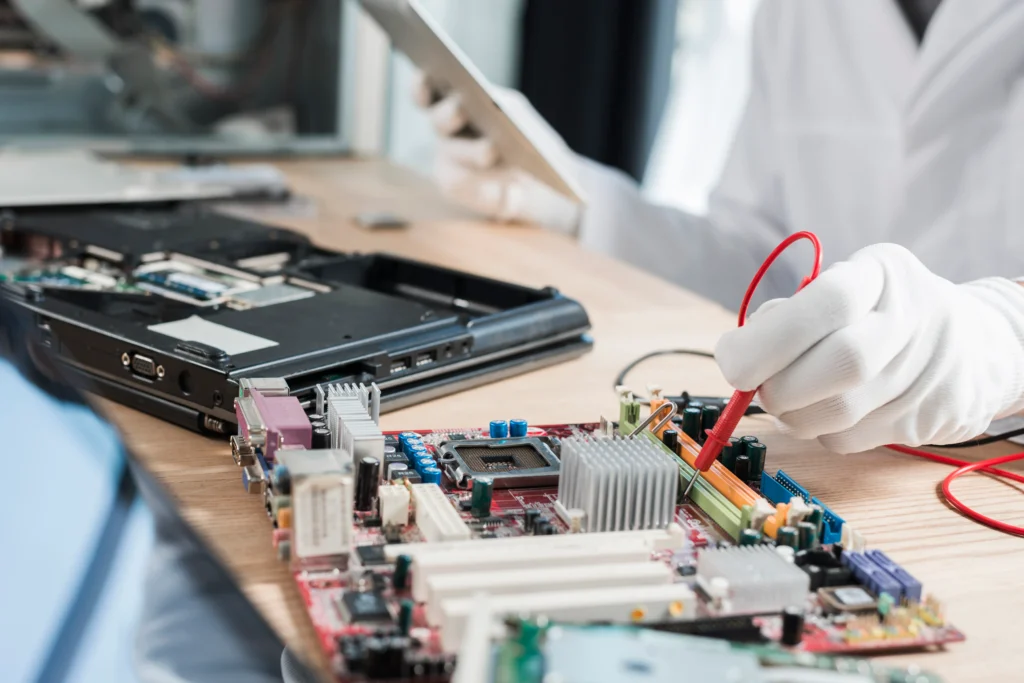 Technician performing Digital Storm laptop motherboard repair in Las Vegas