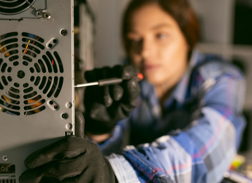 Technician performing laptop fan replacement to ensure smooth laptop performance.