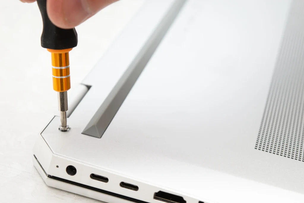 Technician performing Lenovo laptop repair to fix common hardware and software issues.