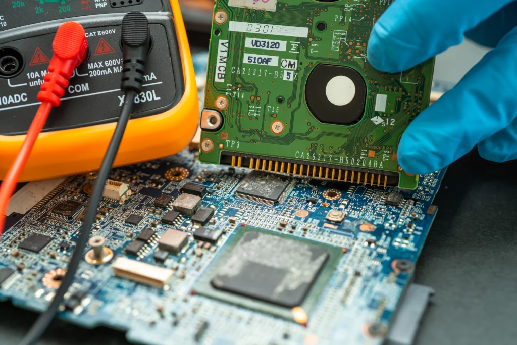HP Laptop Motherboard Repair technician performing component-level diagnostics