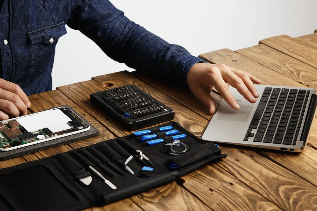 Laptop hinge and frame repair service performed by technician fixing broken laptop hinge and damaged frame